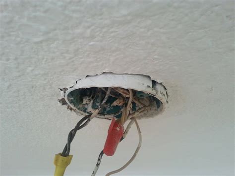 electrical ceiling box isn't properly secured|loose electrical ceiling box.